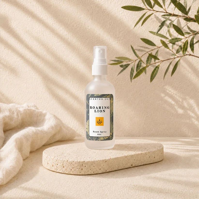 Roaring Lion room spray by Scented Joy on a stone pedestal with natural lighting.