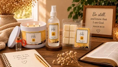 Faith-themed candle, room spray, and wax melts set with an open Bible and religious decor.